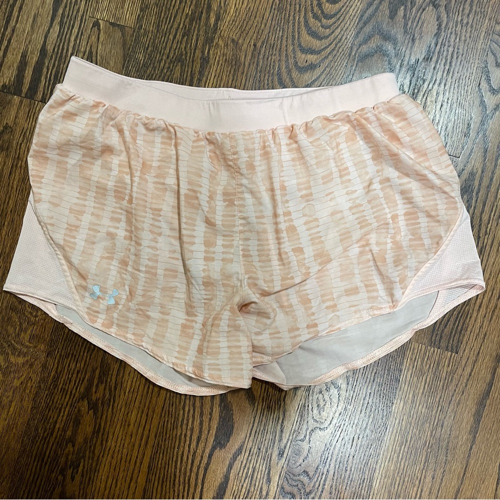 Under Armour Shorts.  Pink/Orange (peach).  Underwear underneath.  Size Large.